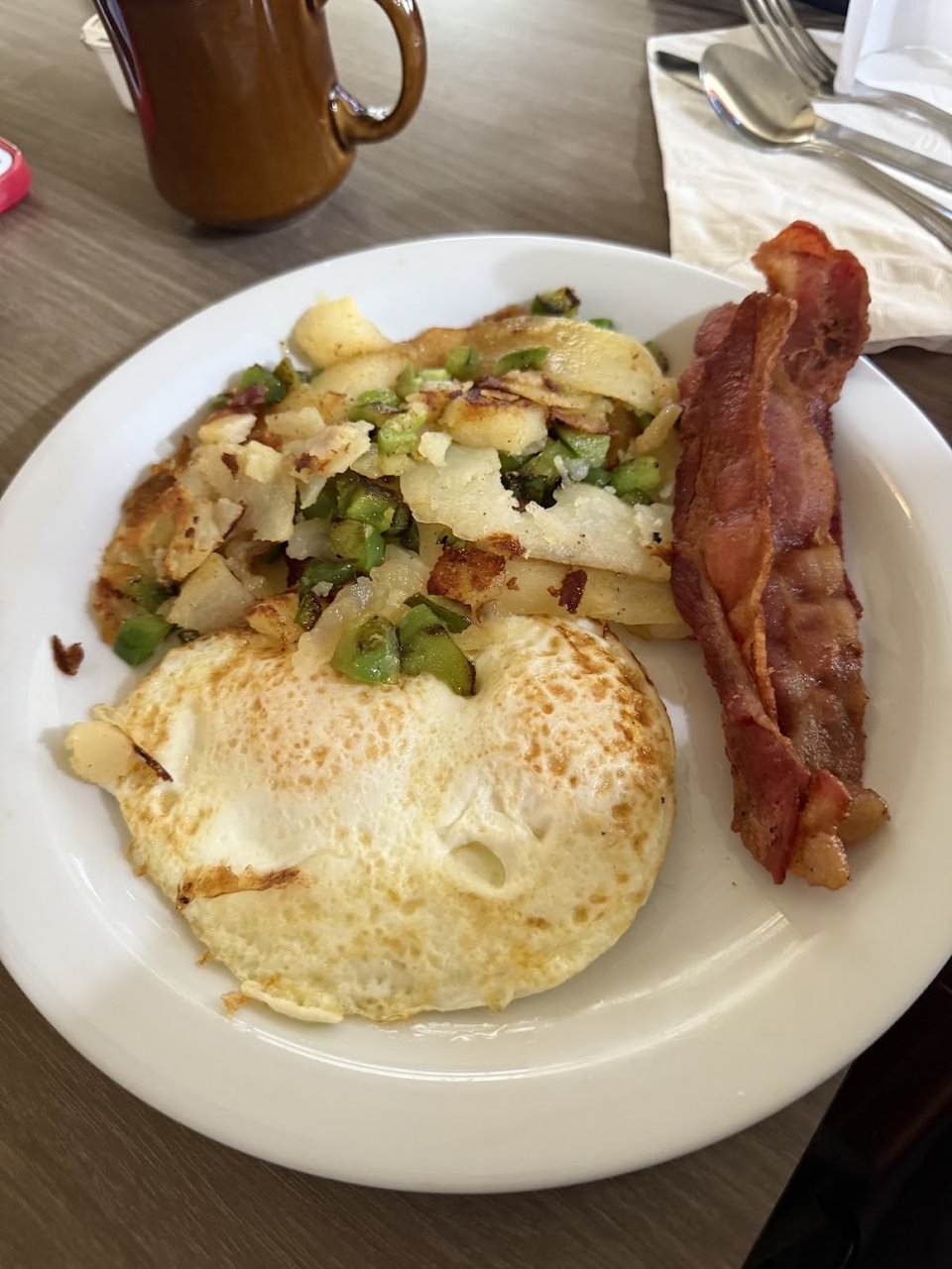 Breakfast menu with omelettes and French toast.