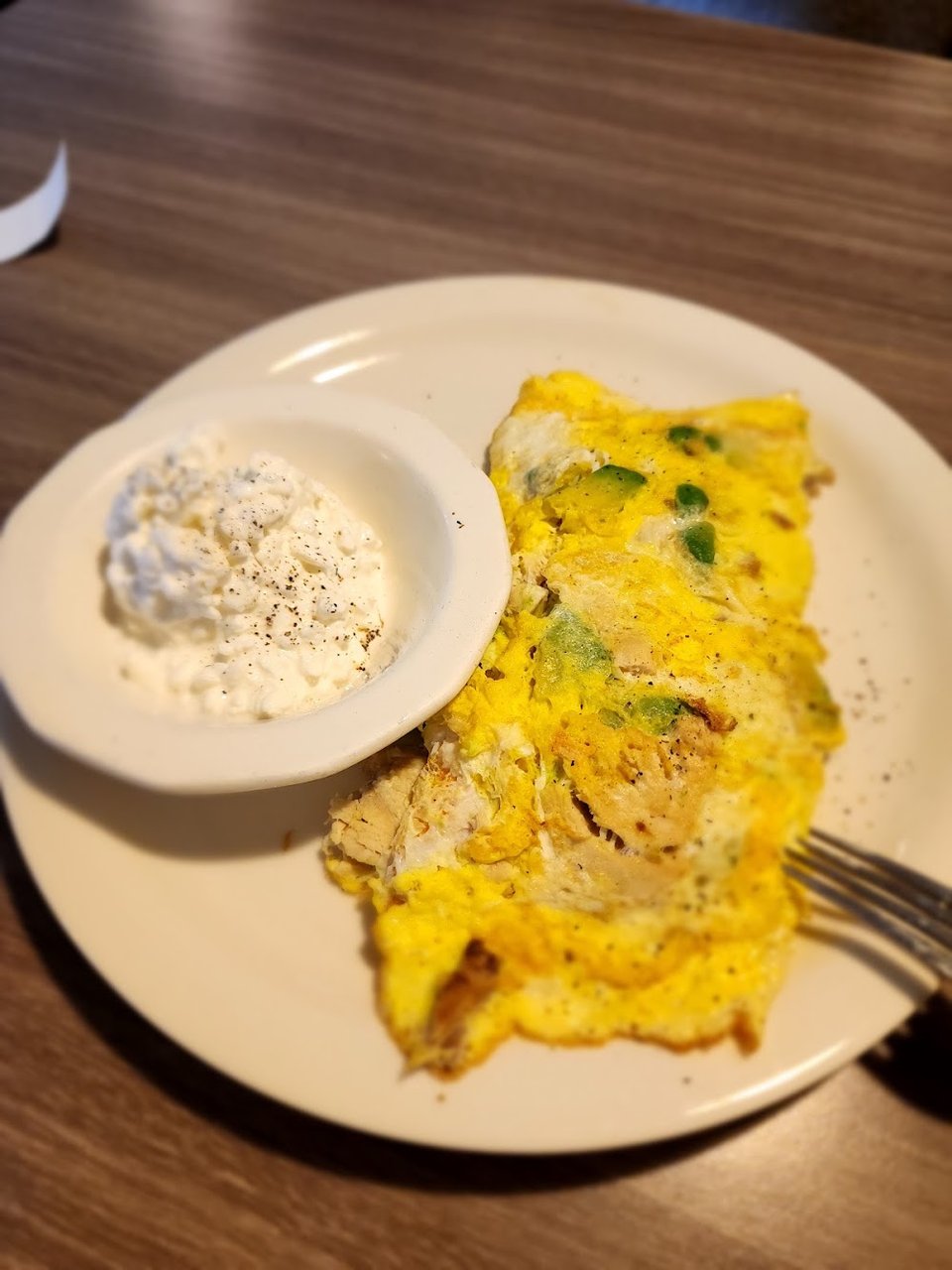 Breakfast menu with omelettes and French toast.