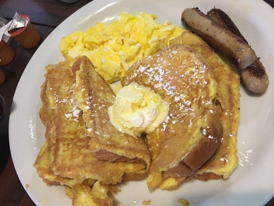 Breakfast menu with omelettes and French toast.