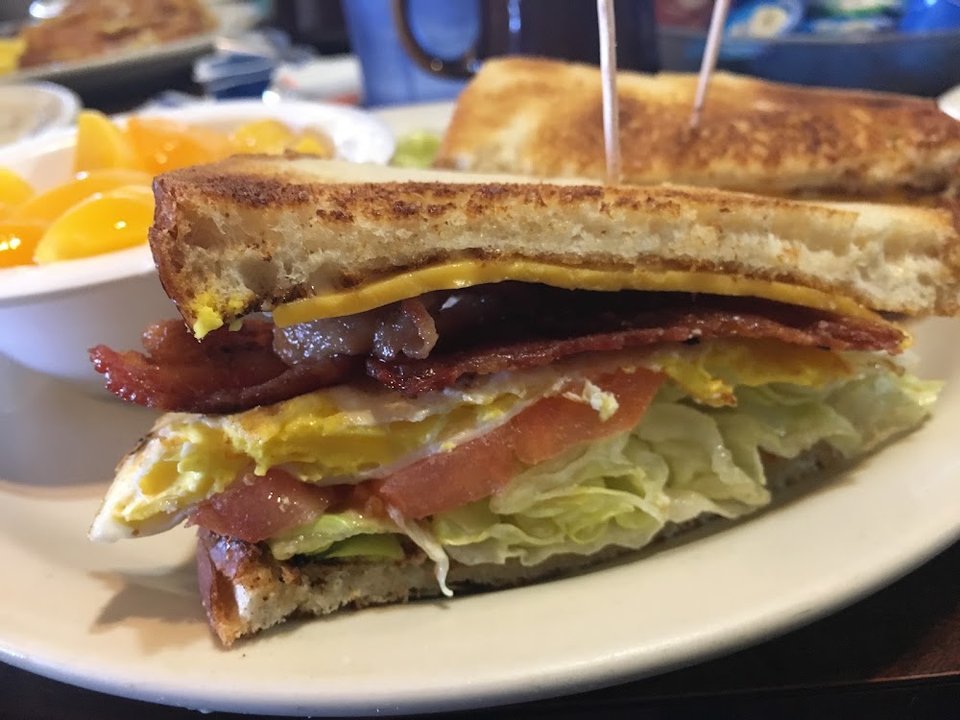 Breakfast menu with omelettes and French toast.